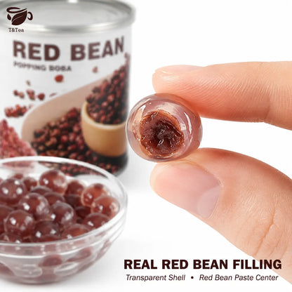 Close-up of a red bean popping boba pearl showing its red bean center.